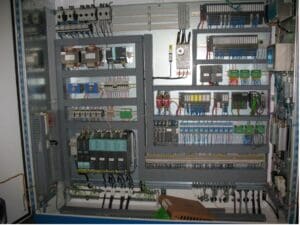 A view of an electrical panel with many wires.